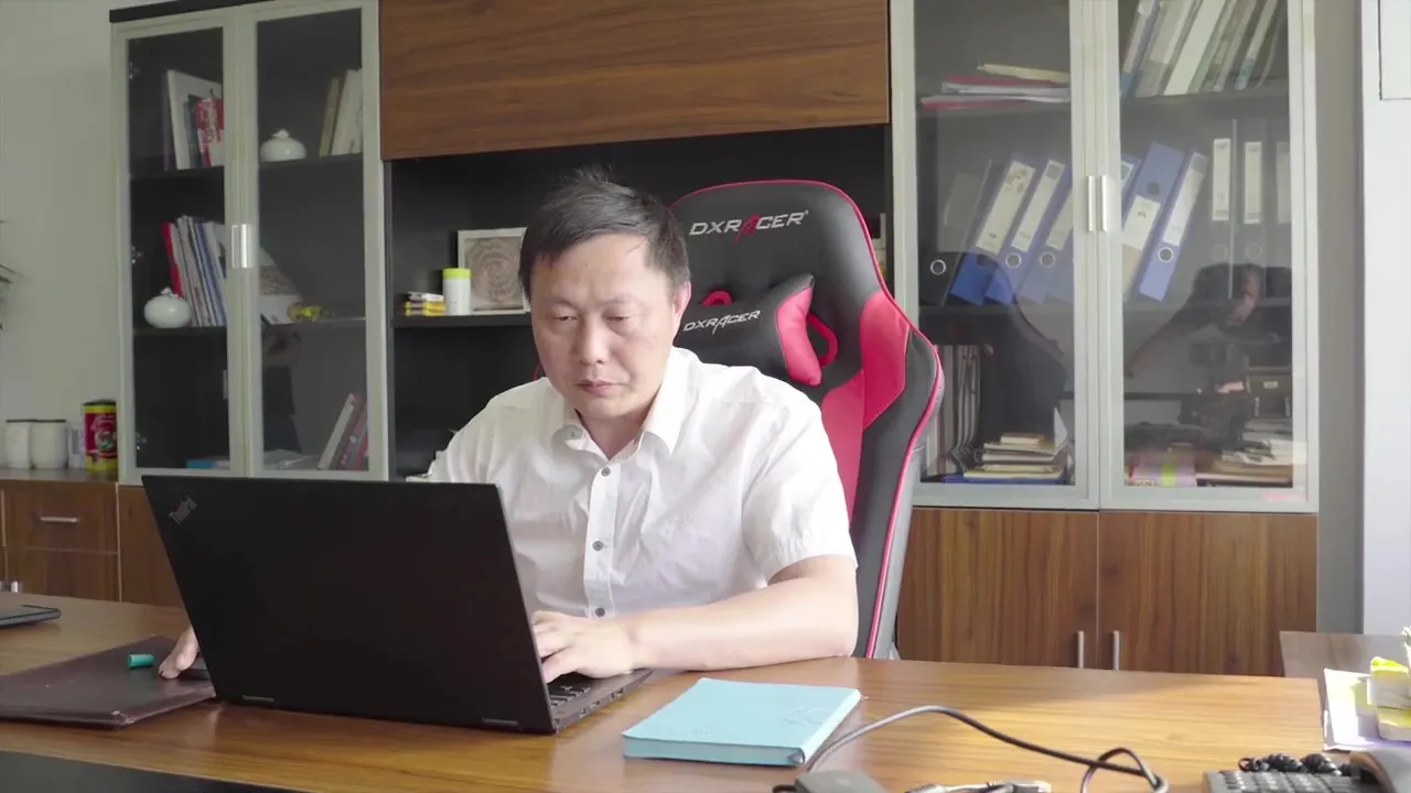 Joshua Gu, founder of Eastragon, working at his desk in Jiangyin.